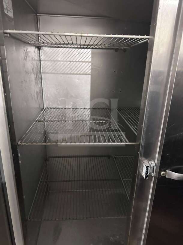 Traulsen G31310 reach-in freezer, three-section solid door, stainless steel, 77", elite condition, fully operational.