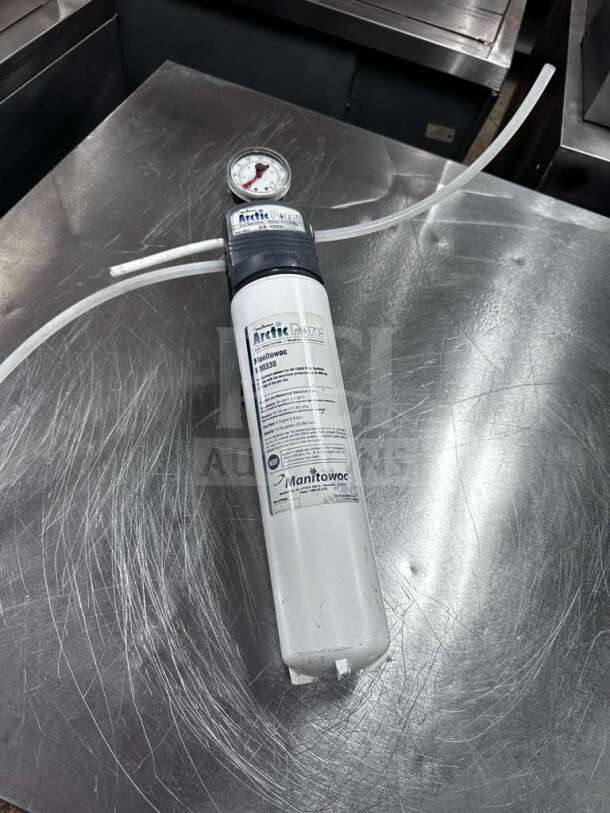 Manitowoc Arctic Pure AR-10000 water filtration system; NSF certified; pristine condition; label indicates model and certification.