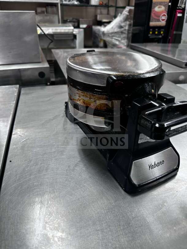 Yabano SW-290B Rotating Belgian Waffle Maker, 1200W, 120V, ETL listed, fully operational, visible wear, on stainless steel surface.