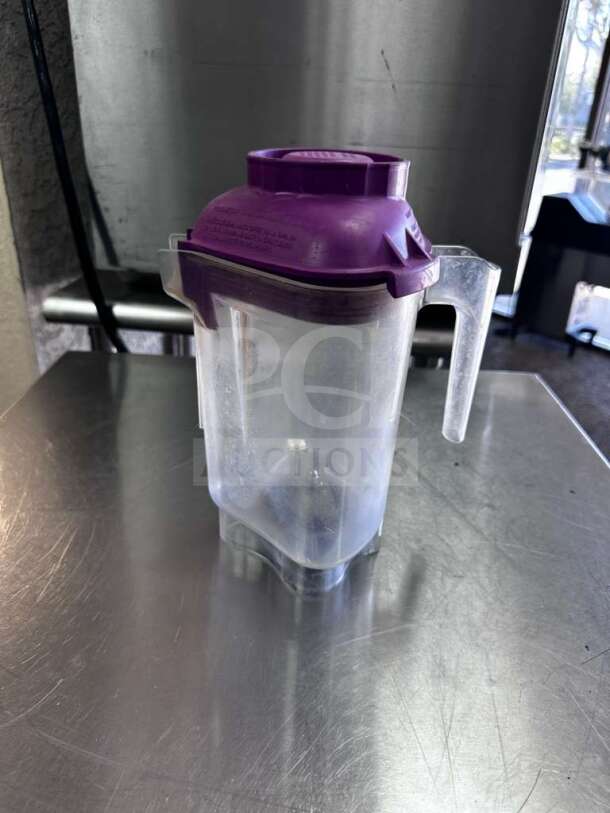 Superior condition Vitamix commercial blender jar, NSF certified, fully tested. Features clear body and purple lid. Model VIT-S-JAR-1012.