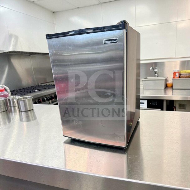 Magic Chef MCUF3S2 3 Cu. Ft. stainless steel upright refrigerator in excellent condition, space-saving design.