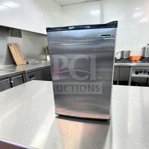 Magic Chef MCUF3S2 compact upright refrigerator, stainless steel, 3 cu. ft., excellent condition, space-saving.