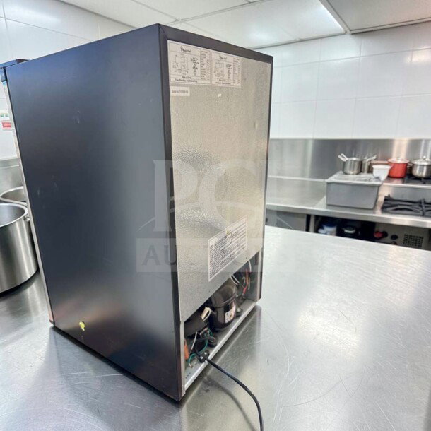 Magic Chef MCUF3S2 3 Cu. Ft. compact upright fridge in stainless steel, excellent condition, tested operational, model label visible.