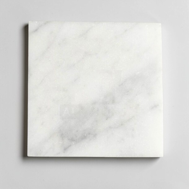 Carrara marble 4x4 honed tile in outstanding condition, white with subtle veining, ideal for interior walls and backsplashes.