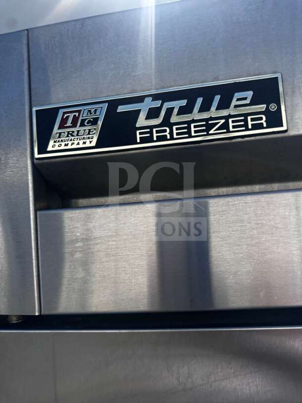 True T-72F commercial freezer, stainless steel, 78", three doors, immaculate condition, True Manufacturing label shown.