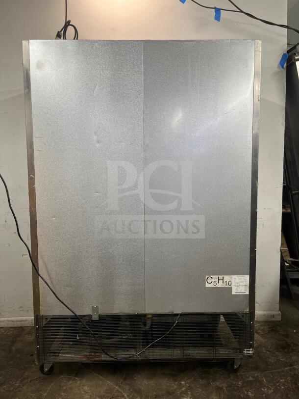 North American Precision Series double glass door merchandiser freezer, Model A2GDF, silver finish, wheeled base, used condition.