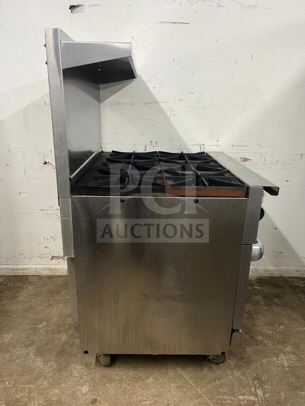 VULCAN 36S-6B 36" gas range with 6 burners and standard oven, natural gas, used condition. Stainless steel exterior.