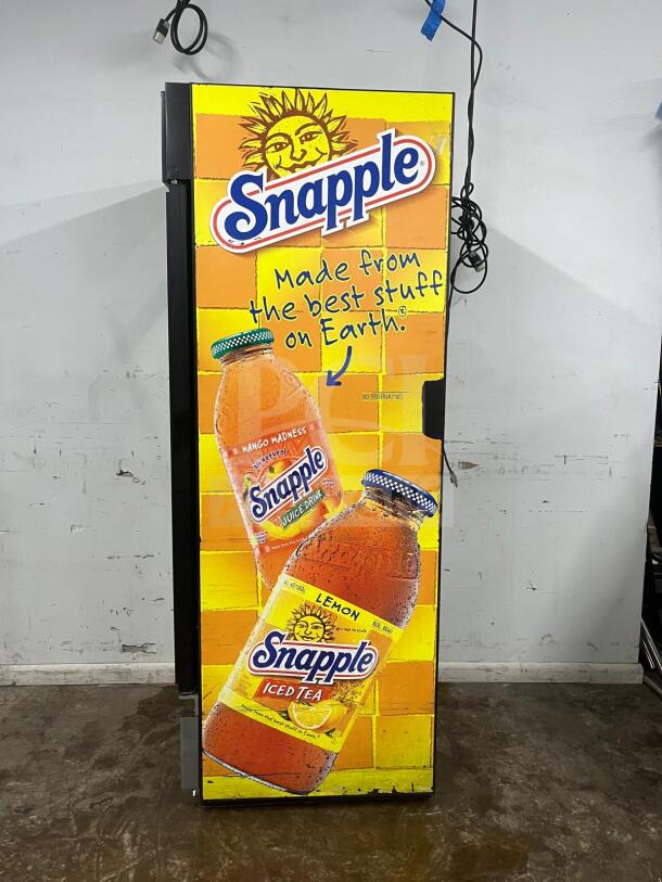 TRUE GDM-19T-LD 27" black refrigerated glass door merchandiser with LED lighting, Snapple branding. Comes with travel case.