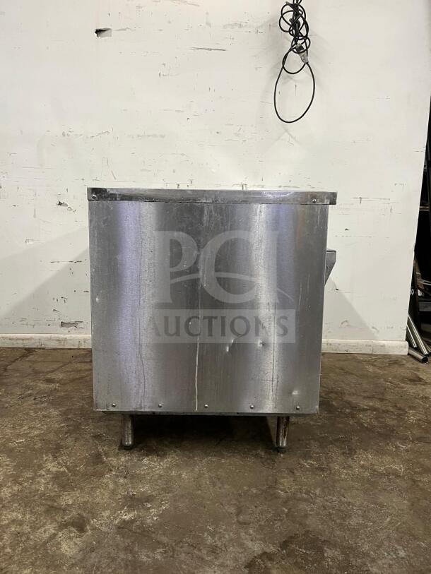 RANDELL 3513-120 48" electric hot food table with three top openings, stainless steel, visible wear, sturdy construction.