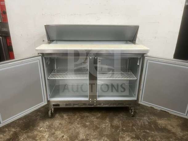 Beverage-Air 48" 2 Door Sandwich Prep Table, stainless steel, open doors, wire shelves, clean condition.