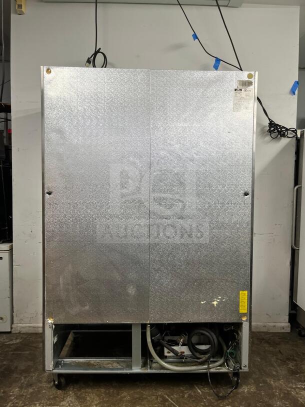 Arctic Air AF49 reach-in freezer with 2 solid doors, stainless steel exterior, visible wiring and label, used condition.