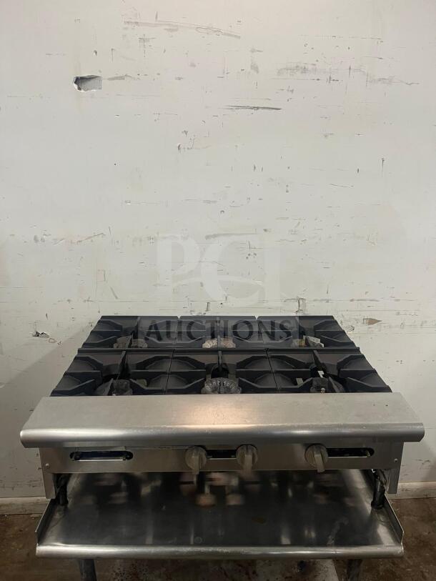 AMERICAN RANGE ARHP-36-6 griddle with 6 burners, 3/4" thick hot plate, 36" wide, heavy-duty, thermostatic. Visible wear.