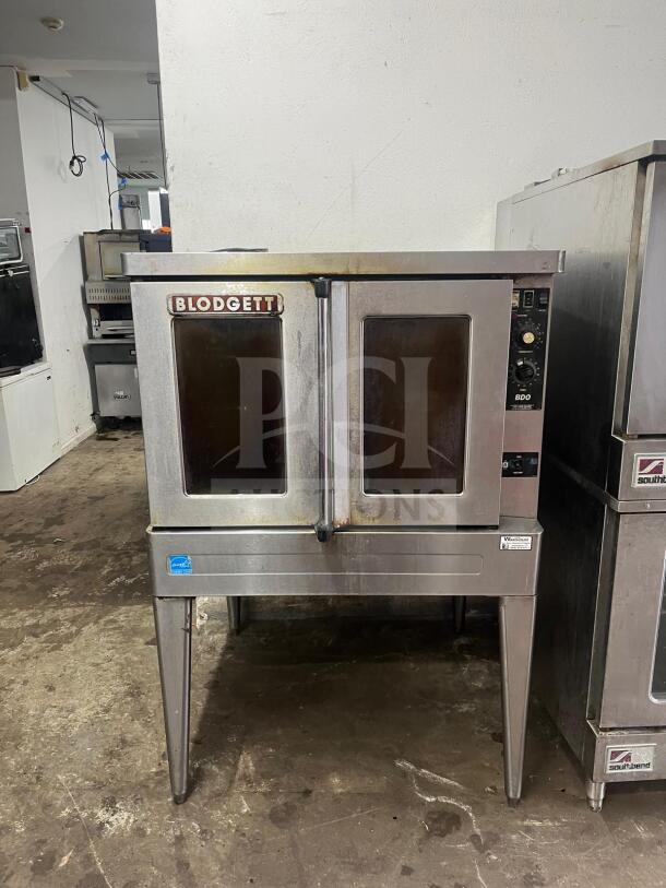 Blodgett BDO-100-G-ES convection oven, stainless steel, dual doors, control panel with knobs, visible wear, model tag present.