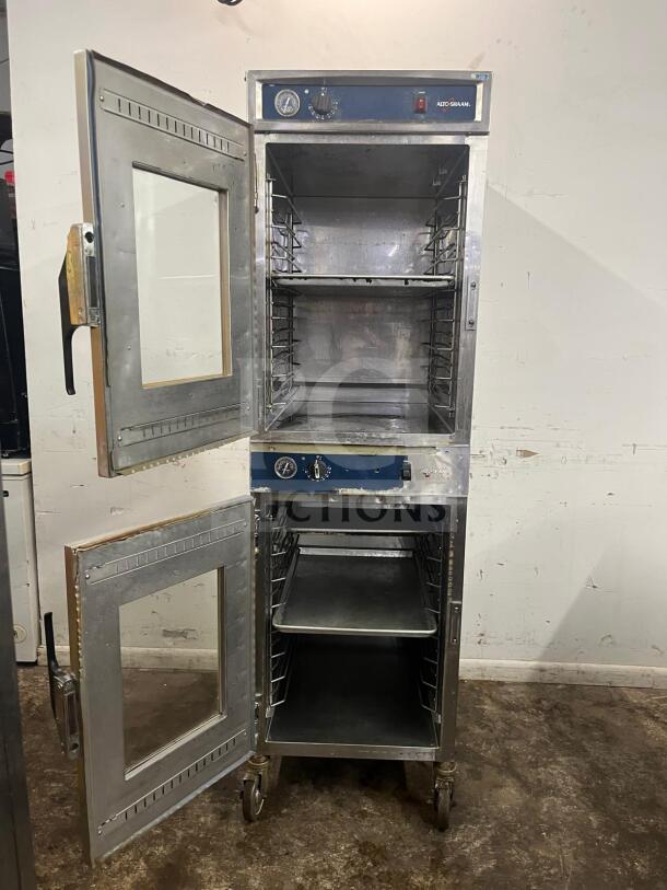 Alto-Shaam 1000-UP Holding Cabinet, 120V, stainless steel, dual compartments, visible controls, caster wheels, used condition.