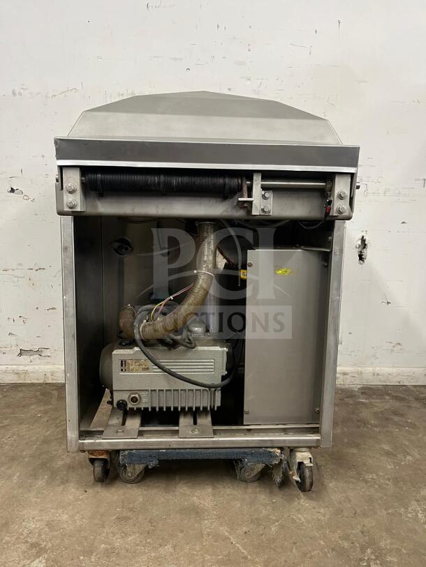 Berkel vacuum packaging machine in very good condition, steel construction, open view showing internal components, Model: Vacuum Machine.