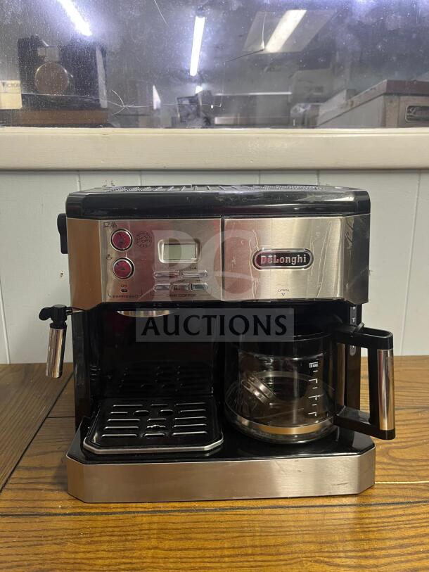 ALT text: DeLonghi BCO430 combination espresso and drip coffee machine in silver and black, features frothing wand and 10-cup carafe.