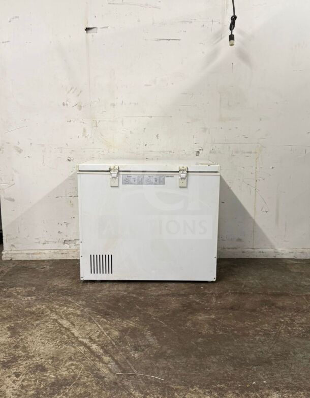MAGIC CHEF deep freezer in white, model unknown, features a spacious interior. Appears to be in good condition.