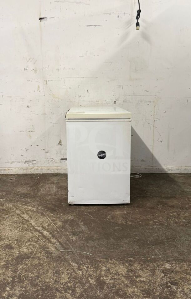 Magic Chef white deep freezer, model unknown, used. Features a top-opening lid. Some wear visible on exterior.