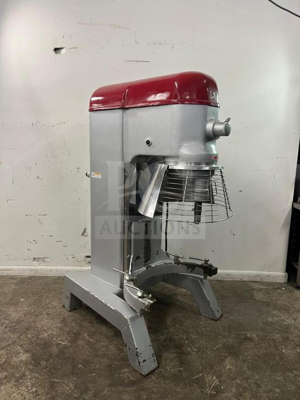 Axis AX-M80 80 Quart Commercial Planetary Mixer, 4-speed, 4 HP. Features a distinct red top. Some wear visible on base.