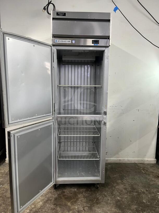 Beverage-Air HF1HC-1HS Horizon Series 26" top-mounted half solid door reach-in freezer, featuring open doors and wire shelves.