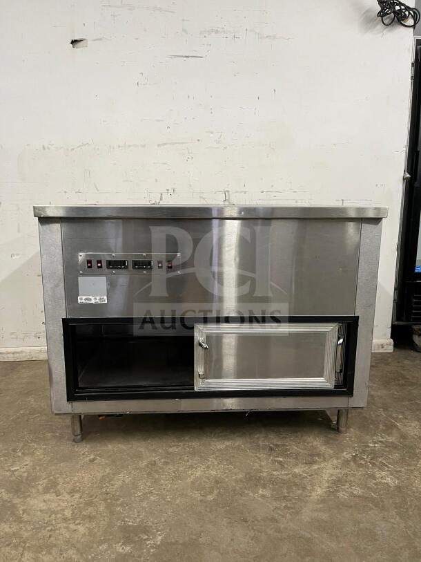 Stainless steel prep table with salad bar, by PREP TABLE. Features control panel and lower storage. Excellent condition.