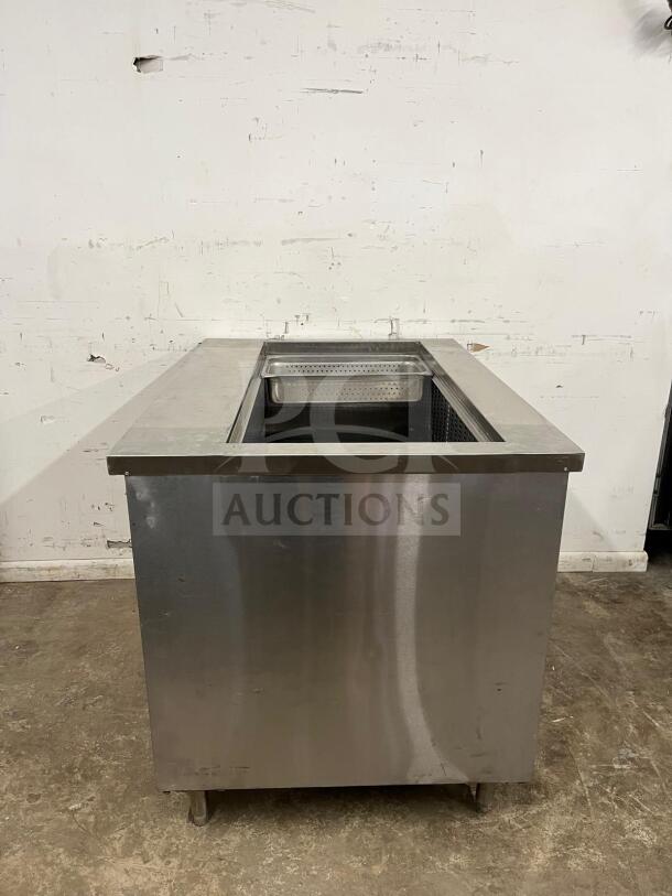 PREP TABLE stainless steel prep table with integrated salad bar, durable construction, good condition, ideal for kitchens.