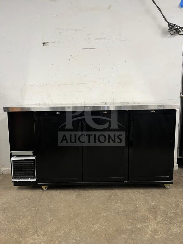 Dukers Back Bar Beverage Cooler DBB72, black finish, three doors, on wheels, lightly used, suitable for commercial use.