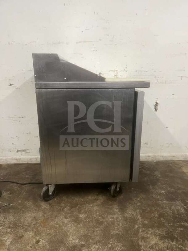 True TSSU-27-08-HC refrigerated sandwich prep table, stainless steel, right hinged door, good condition, on wheels.