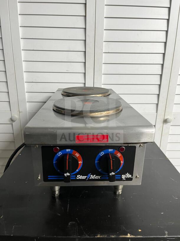 Star 602HF Star-Max® 12" electric hot plate, dual burners, stainless steel finish, "Caution Hot" label, rotary controls.