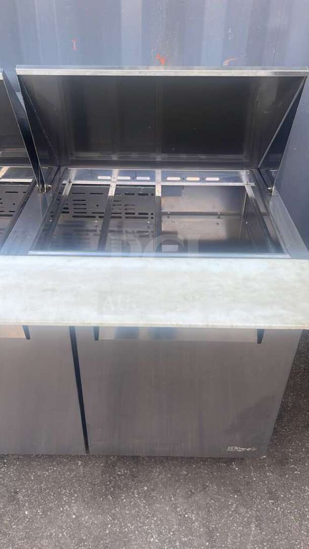 Turbo Air MST-72-30-N M3 Series 72" stainless steel 3-door refrigerated sandwich prep table with open lid, in good condition.