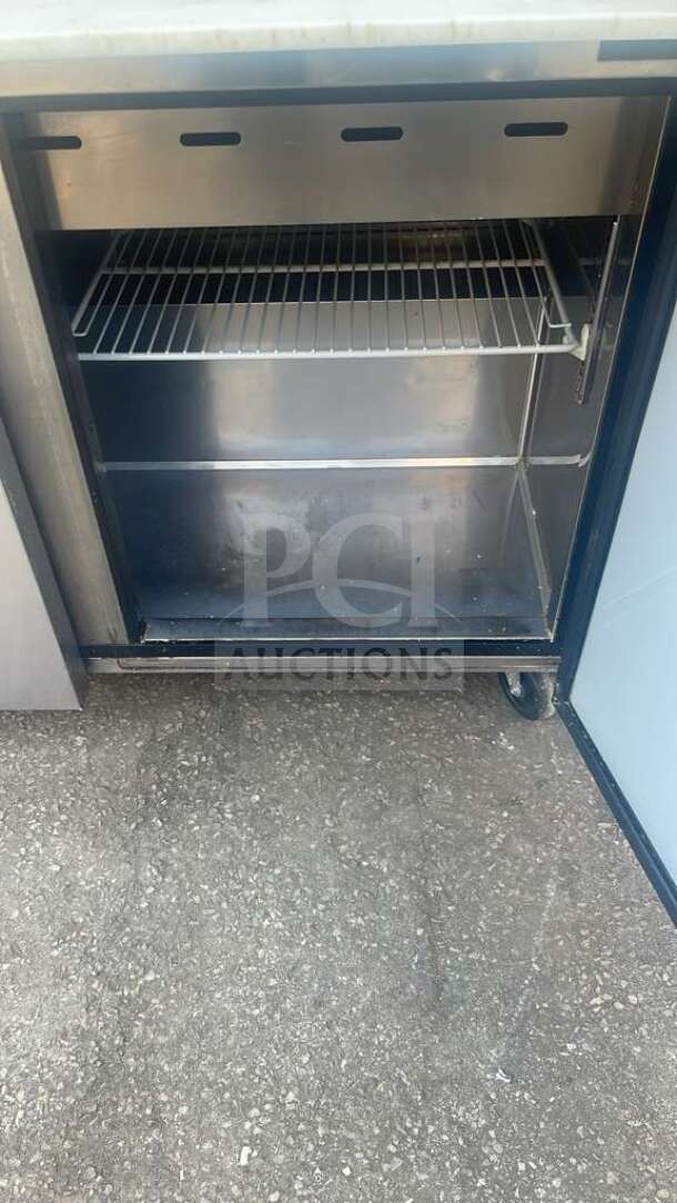 Turbo Air MST-72-30-N M3 Series 72" stainless steel sandwich prep table, open door, showing interior shelving.
