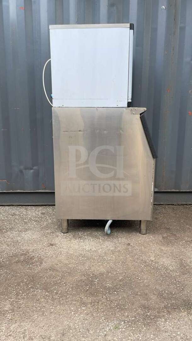HLH350 Commercial Ice Machine in stainless steel, upright model, good condition, features durable construction and water hose.