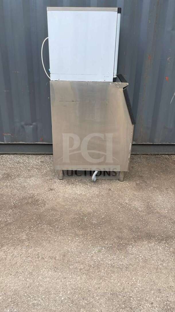 HLH350 commercial ice machine, stainless steel, upright design, visible power cord, well-maintained condition.