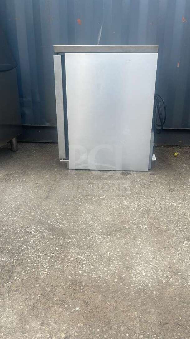 True TUC-24-HC 24" undercounter refrigerator, stainless steel, gently used, visible power cord, ideal for compact spaces.