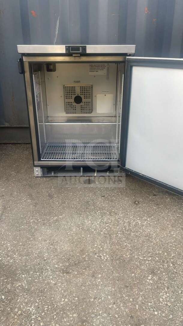 True TUC-24-HC 24" undercounter refrigerator, stainless steel, open door, visible shelving, clean condition.