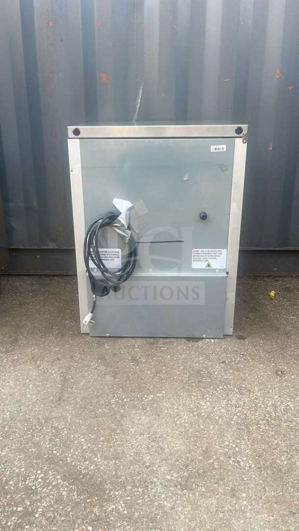 True TUC-24-HC 24" undercounter refrigerator, stainless steel, with power cord attached, visible label, good condition.