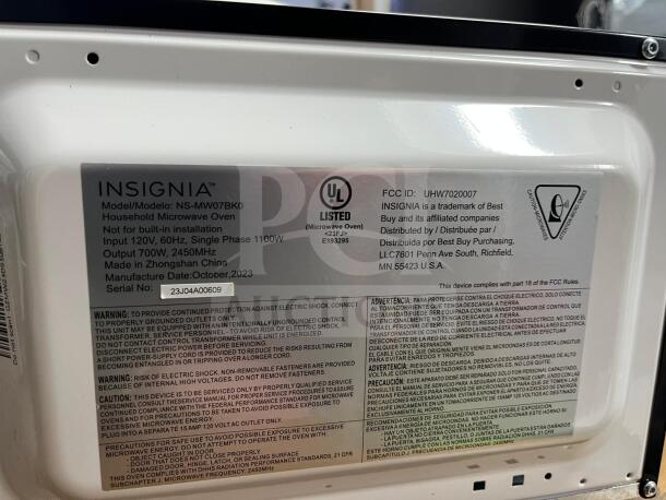Insignia NS-MW07BKO 0.7 Cu. Ft. Compact Countertop Microwave. Model details visible. New, manufactured October 2023.