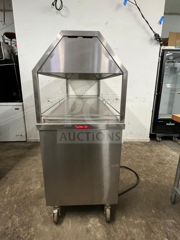 Stainless steel Gaylord hot food steam buffet table in amazing condition. Features include a "Caution - Hot" label and wheels for mobility.