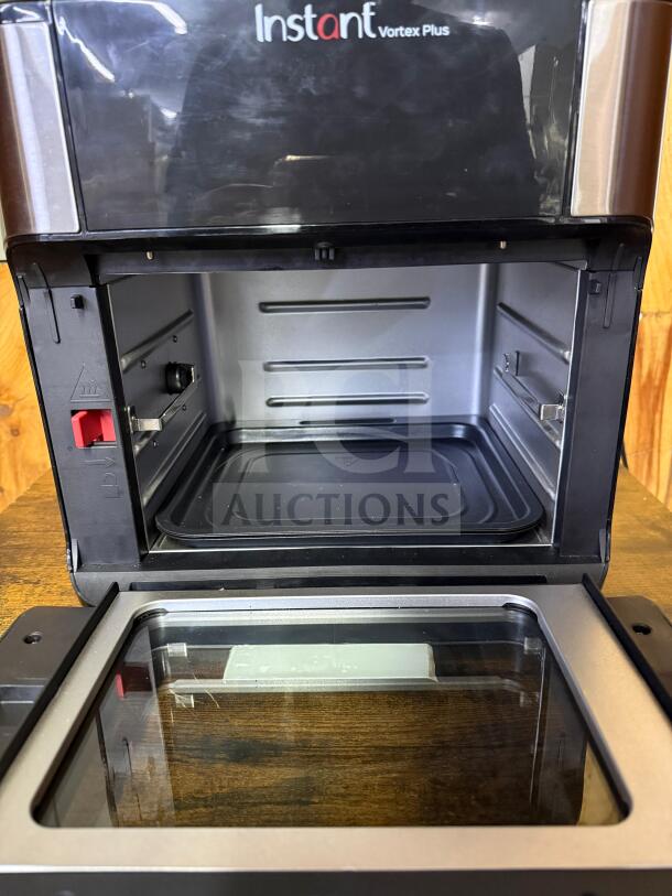 Instant Pot Vortex Plus 10 Quart Air Fryer Oven, model Vortex Plus, with open door, showcasing interior and controls.