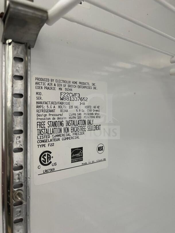 Arctic Air F22CWF 22 Cu.Ft Commercial Reach-In Freezer, solid door, NSF certified, model tag with specs visible.