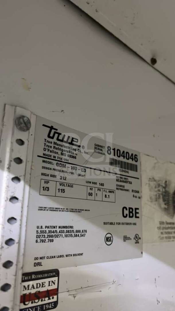 True GDM-26 merchandiser refrigerator label showing model, voltage, and manufacturing details. Made in USA.
