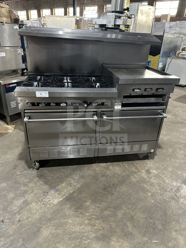 Commercial stainless steel gas-powered 6-burner and grille with 2 standard ovens on casters, good condition.