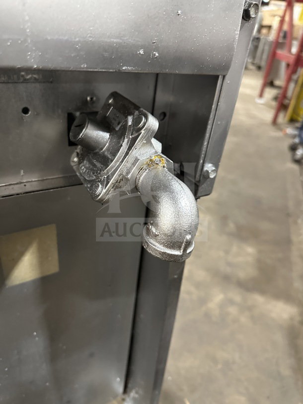 Commercial stainless steel gas connector on 6-burner and grille unit. Featuring two standard ovens and casters for mobility.