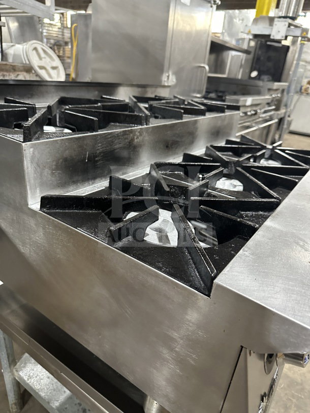 UltraMax 6-burner stainless steel gas hot plate range on equipment stand; used commercial kitchen equipment.