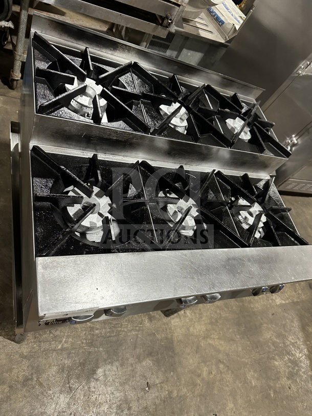 UltraMax stainless steel 6-burner gas countertop hot plate on open stainless steel stand, excellent condition.