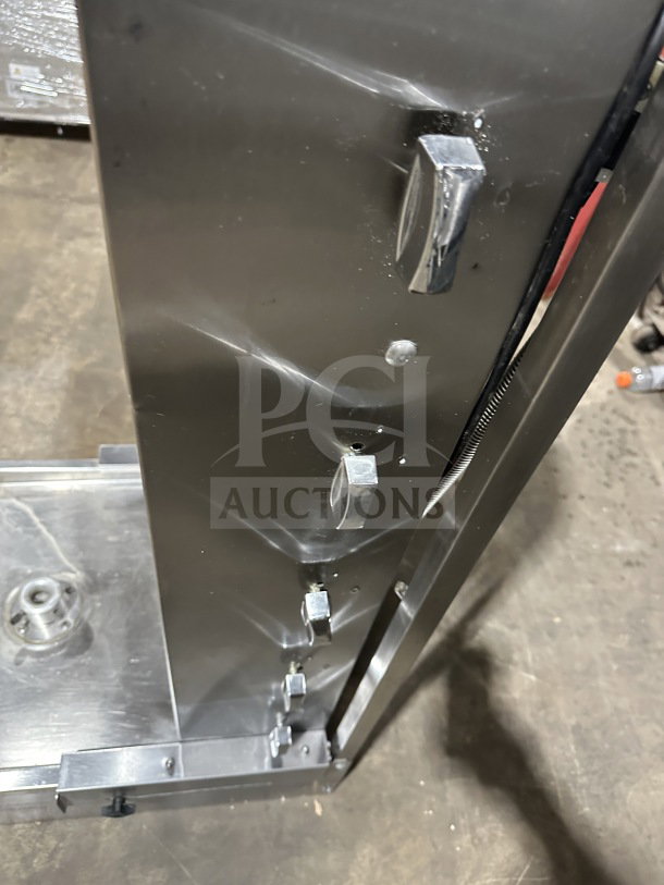 Sheffcat commercial stainless steel 5-burner gas vertical broiler in good condition, featuring durable metal knobs and sturdy construction.
