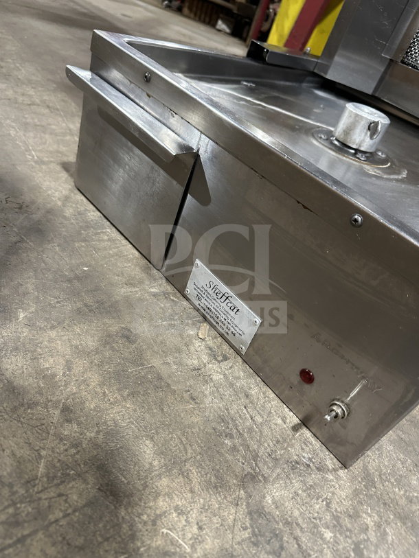 Sheffcat stainless steel 5-burner vertical broiler, gas-powered, commercial use, features control panel and logo plate, lightly used.
