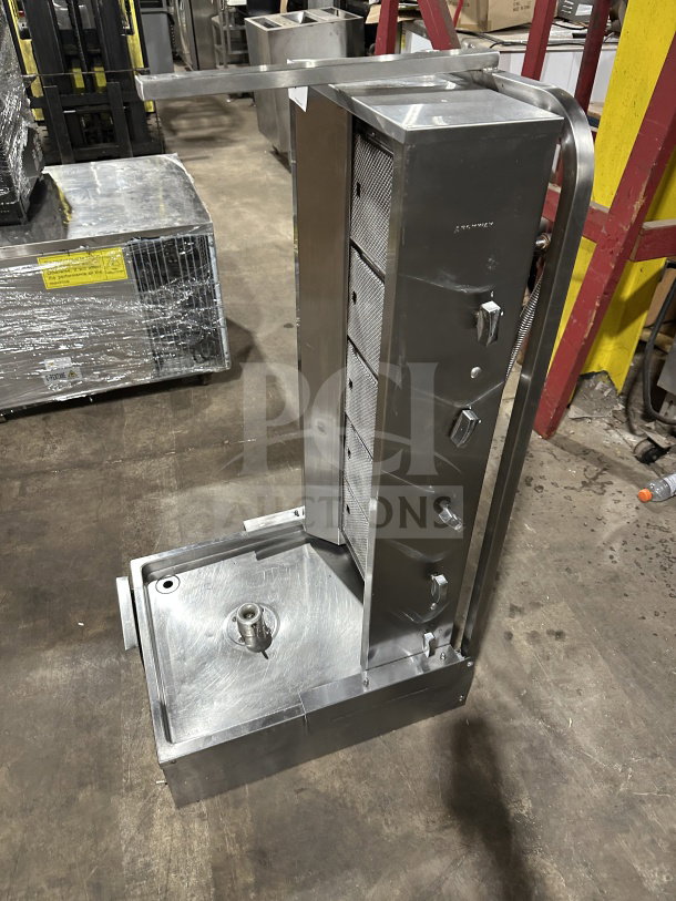 Sheffcat stainless steel 5-burner gas-powered vertical broiler, new condition, with adjustable burners and drip tray.