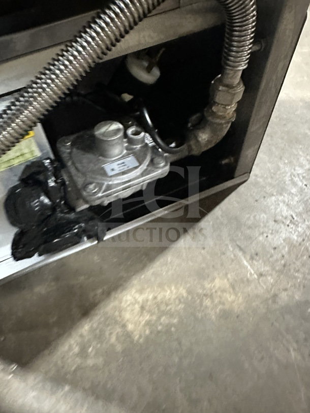 Sheffcat 5-burner vertical broiler, stainless steel, gas powered, commercial use, showing gas connection details.