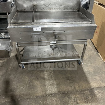 Commercial stainless steel gas griddle with thermostatic control, integrated divider, stand on casters; used condition.